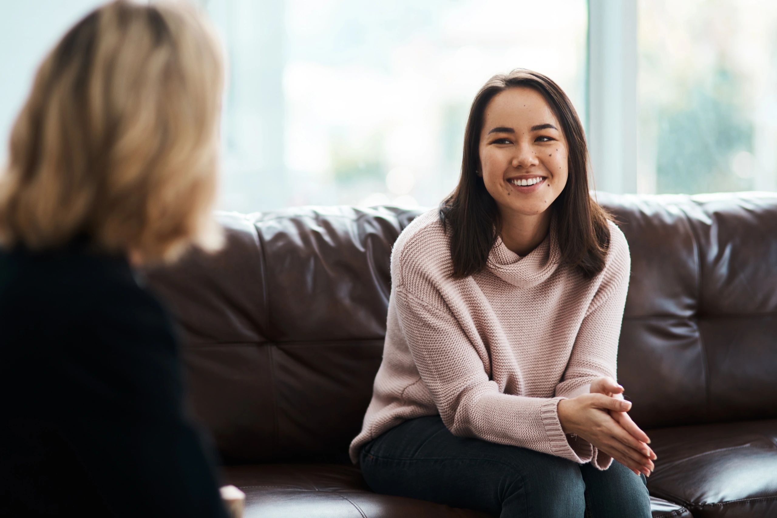 Professional reviewing interview resources on a digital device